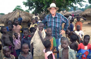 Ken Goyer with kids in village