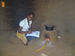 Aid Africa staff member logging location of stove